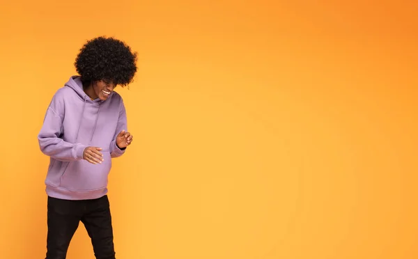 Happy Man Afro Hair Wearing Fashionable Hoodie Dancing Orange Background — Stock Photo, Image