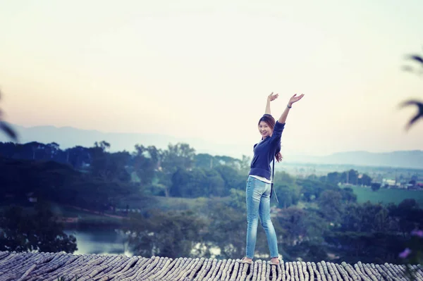 asia tourism woman posing on view point with mountrain