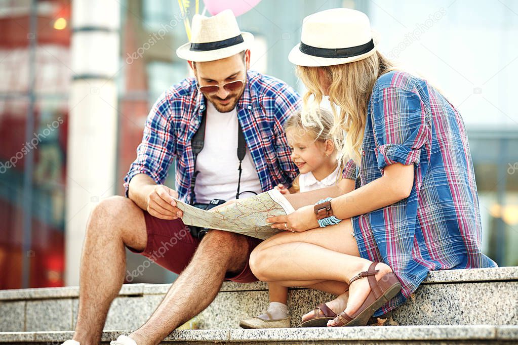 Young and happy family is enjoying traveling.