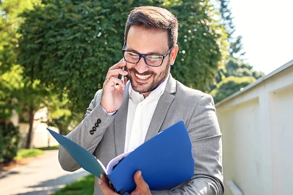 Young Businessman Using Mobile Phone Front Company Building Stock Picture