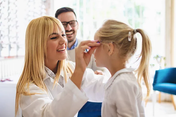 Happy Family Choosing Glasses Optics Store Royalty Free Stock Images