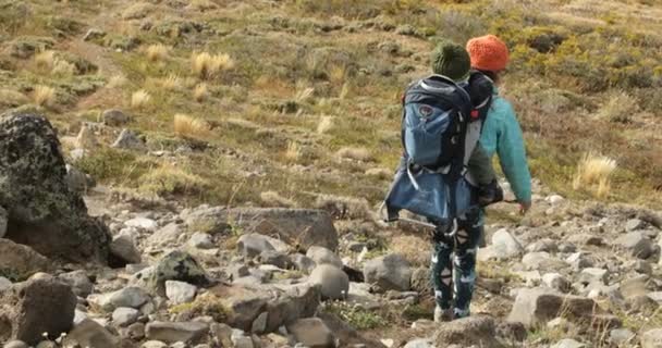 Trekking Batea Mahuida Volcano Lady Carrying Baby Walking Rocky Slope — Stock Video