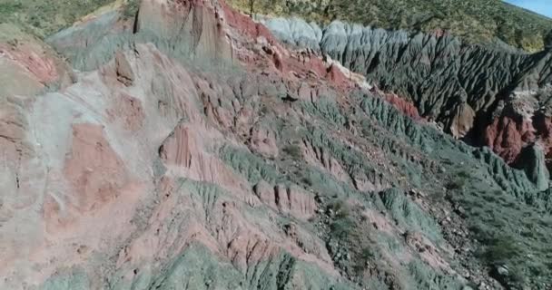 Aerial drone scene of colourful mountains made of eroded sandstone in Famatina mountains. El Pesebre. La Rioja touristic spot. Camera ascends. — Stock Video