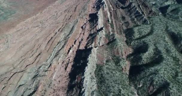 Aerial senital drone scene of red and white landscape of folded mountains. Camera showing top view of natural colorful layers. Huaco, San Juan province, Argentina — Stock Video