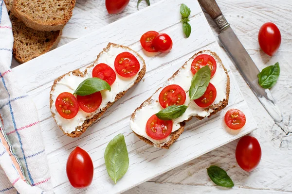 Bruschetta Cream Cheese Cherry Tomatoes Basil Wooden Table — Stock Photo, Image