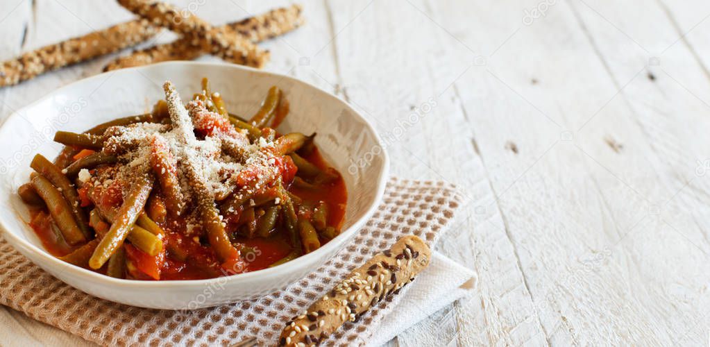 Stewed french bean with tomato and grated cheese