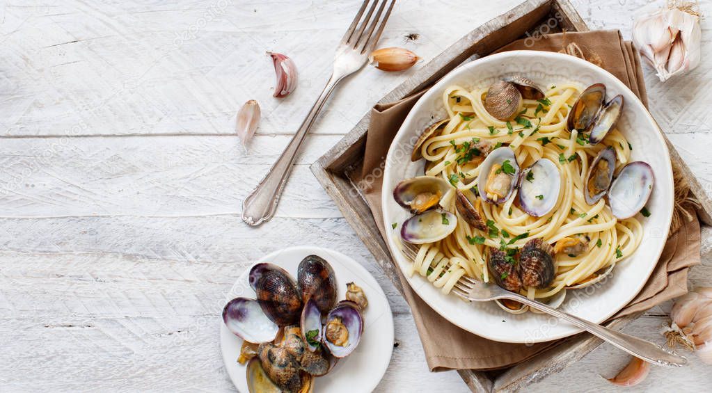 Linguini with clams top view - Traditional italian seafood pasta