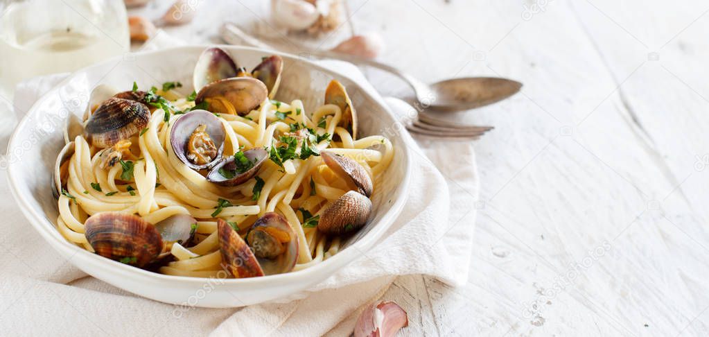 Linguini with clams top view - Traditional italian seafood pasta