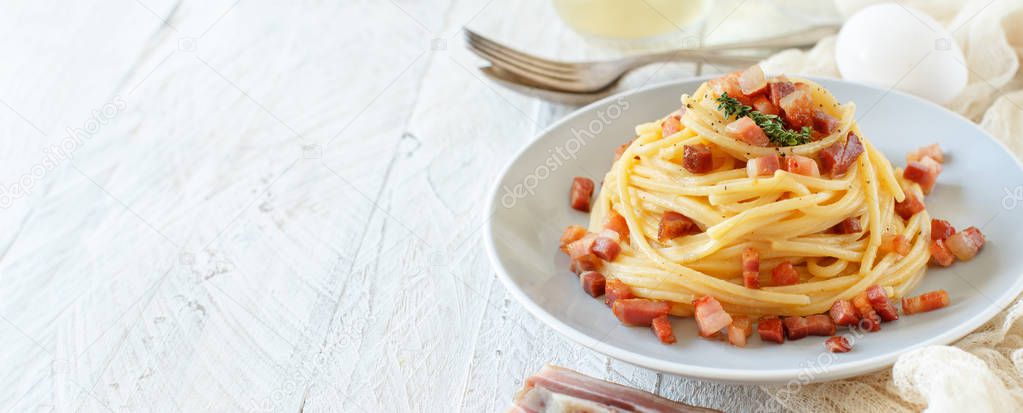 Traditional italian dish spaghetti carbonara with bacon, egg and cheese