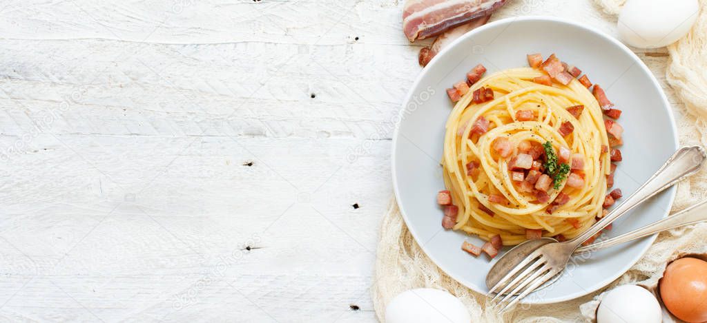 Traditional italian dish spaghetti carbonara with bacon, egg and cheese