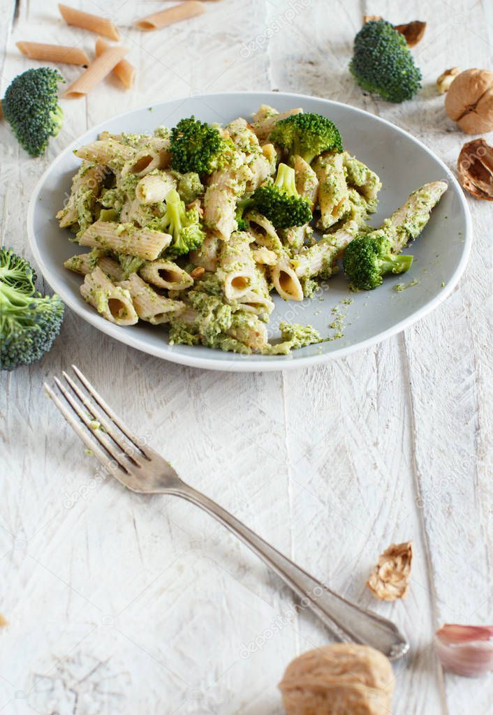 Wholegrain Pasta with broccoli and walnuts cream close up