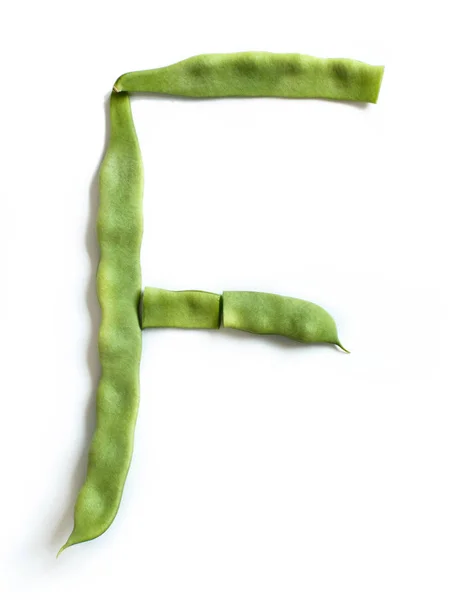 Letter F made from  Piattoni green beans — Stock Photo, Image