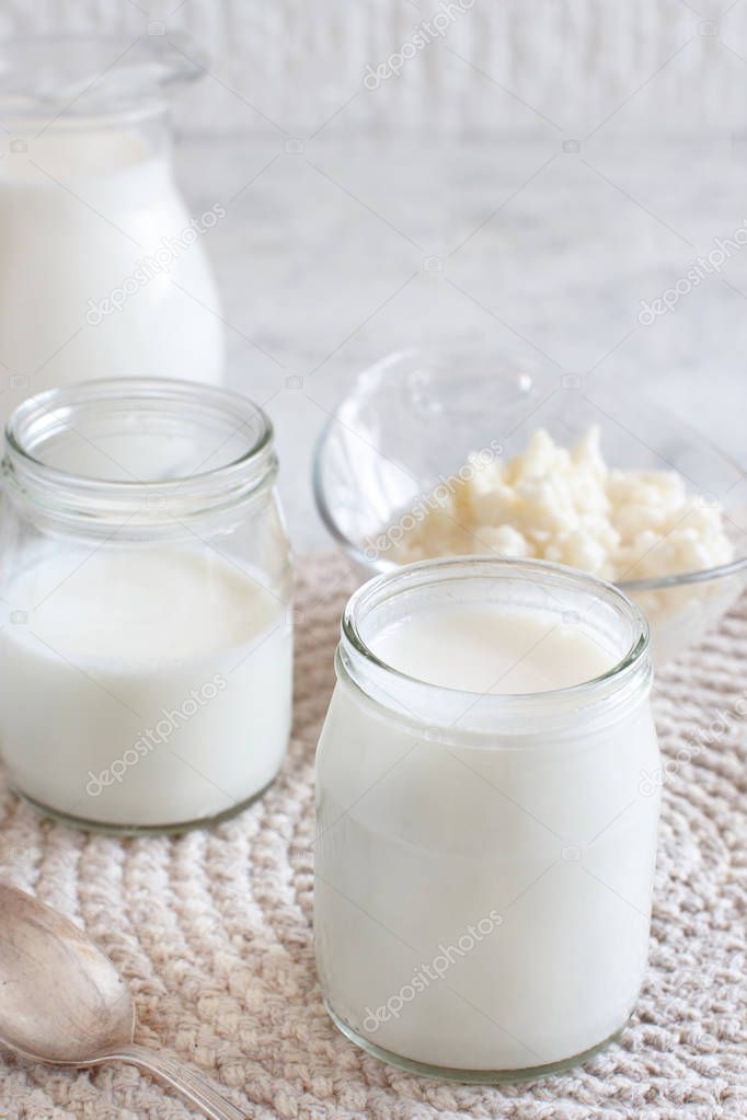 Fermented drink kefir in small bottles and kefir grains