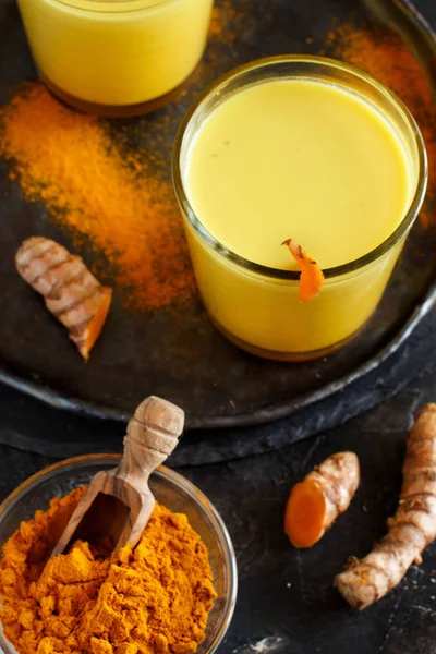 Golden milk with turmeric powder — Stock Photo, Image