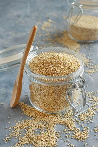 Glass Jar Raw Dry White Quinoa Seeds Grey Table Close — Stock Photo, Image