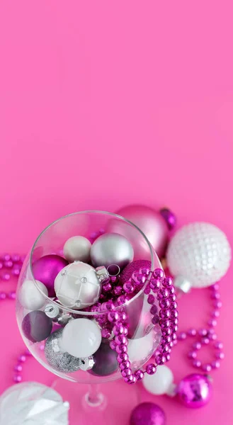 Christmas Baubles Wine Glass Pink Background Close — Stock Photo, Image