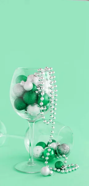 Christmas Baubles Wine Glass Light Green Background Close — Stock Photo, Image