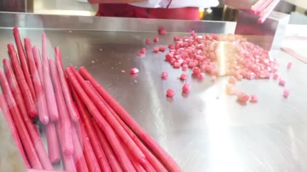 Manufacture of caramel candies, cutting caramel candies. close-up of 4k. Slow motion — Stock Video