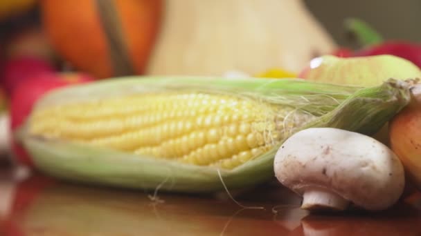 Autumnal Harvest or Thanksgiving, Cornucopia filled with vegetables, vegetables spilled out of the basket on the table. 4k, dolly shot — Stock Video