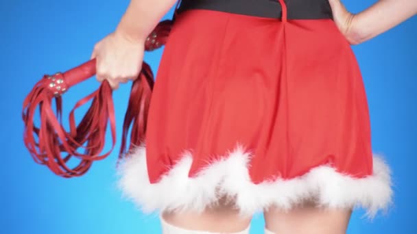 Seductive santa girl with sex toys in seductive poses. on a blue background. a close-up. Slow motion. 4k — Stock Video
