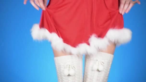 Christmas holidays. young attractive woman in a Snow Maiden costume dancing on a blue background. close-up, slow-motion, 4k — Stock Video