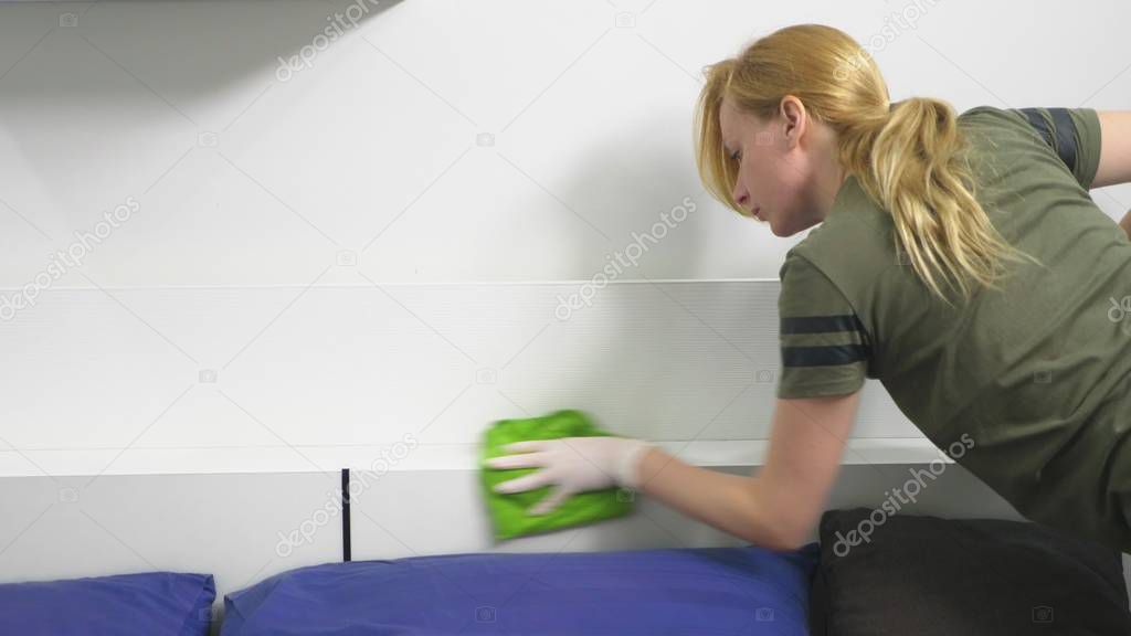 young woman cleaning the bedroom with cleaning products and equipment, Housework concept