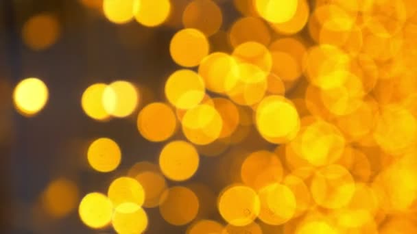 Fundo dourado bokeh. um monte de luzes embaçadas douradas — Vídeo de Stock