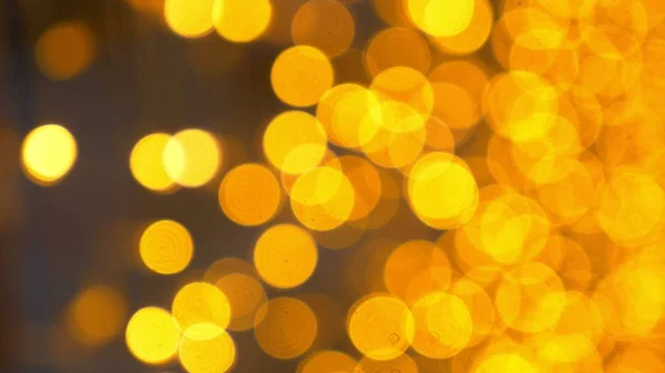 Goldener Bokeh-Hintergrund. viele goldene verschwommene Lichter — Stockfoto