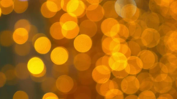 Goldener Bokeh-Hintergrund. viele goldene verschwommene Lichter — Stockfoto