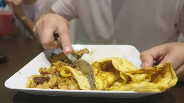 close-up. someone eats a dish of asian cuisine in a restaurant.