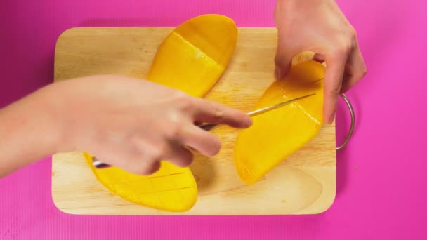 Top View Female Hand Cuts Fruit Knife Wooden Board Mango — Stock Video