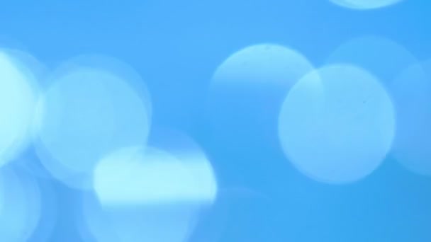 Fondo abstracto. fondo hermoso azul con reflejos redondos blancos — Vídeo de stock