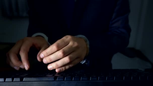 Close-up, hands of a businessman working on a computer keyboard in handcuffs. concept of cyber crime, workaholism — Stock Video