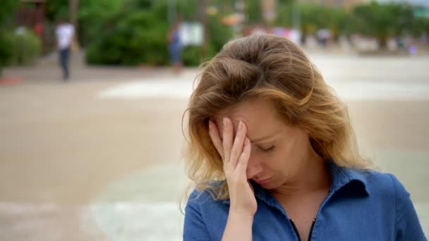 Closeup, sad young woman in depression, outdoors. Negative emotions, facial expression, sense , of body language — Stock Video