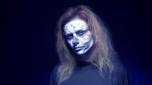 Concept of horror, ghost woman in the forest. Beautiful woman with make-up skeleton in a scary forest. — Stock Video