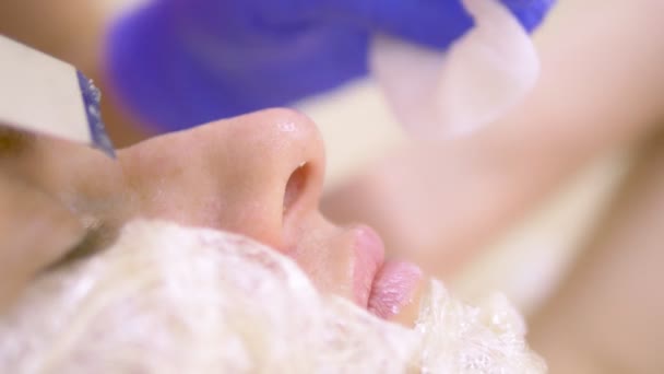 Close-up. Ultrasonic face cleaning. Modern equipment. Beautician does cosmetic procedure on woman face. — Stock Video