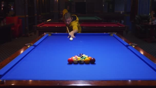 Couple, man and bald woman play american billiards. — Stock Video