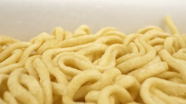 Super close details of dry instant noodles. background texture — Stock Video