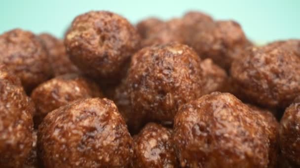 Super closeup details. breakfast cereals in the form of chocolate corn balls . — Stock Video