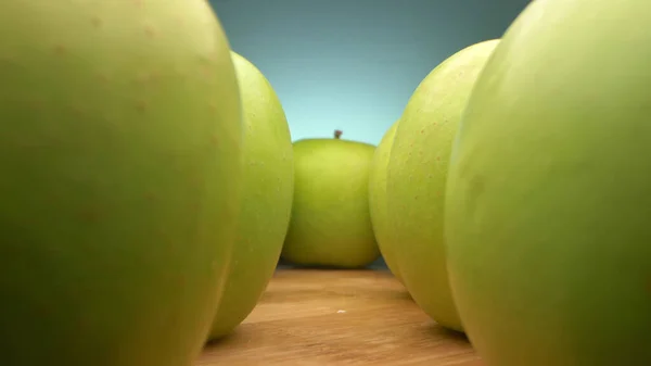 View between rows of green apples. super close up. — Stock Photo, Image