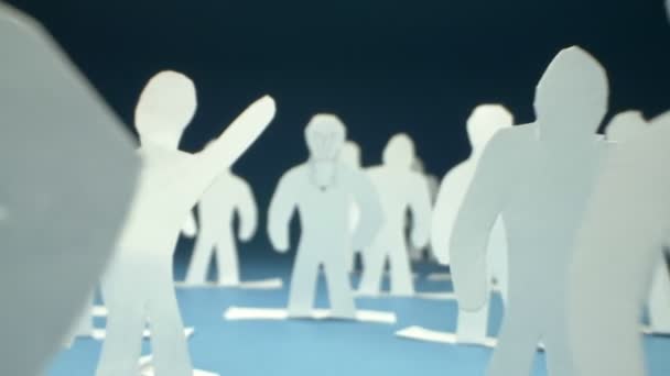 Super closeup. silhouettes of people cut from paper. community concept — Stock Video