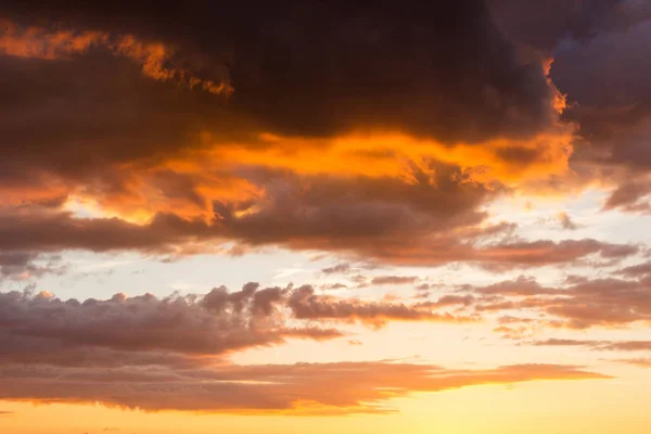 Storm clouds at sunset in bright colors — Stock Photo, Image