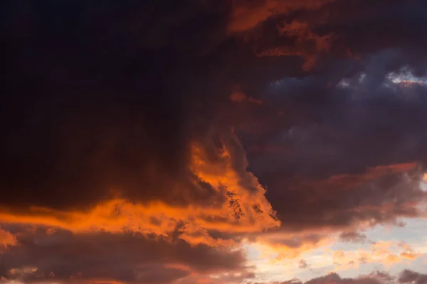 Storm clouds at sunset in bright colors — Stock Photo, Image