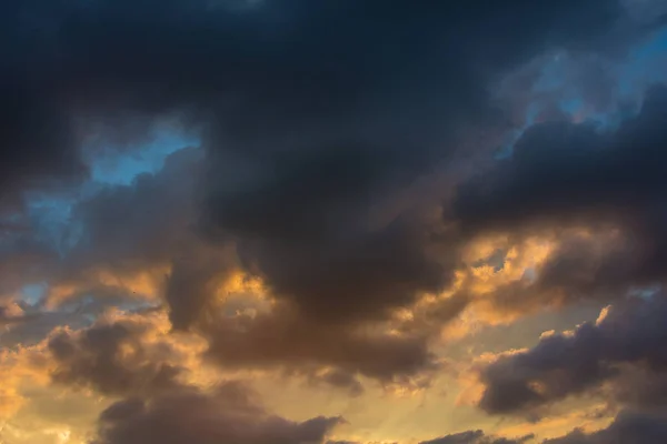 Storm clouds at sunset in bright colors — Stock Photo, Image