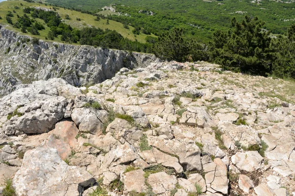 on a high mountain you can see the entire beach and coast during the day in summer