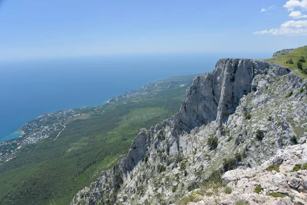 on a high mountain you can see the entire beach and coast during the day in summer