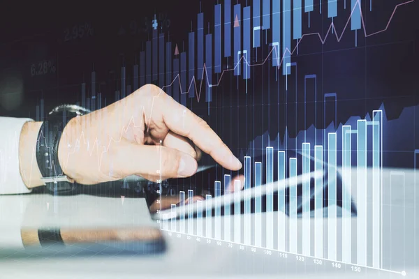 Multi exposure of abstract creative financial graph with finger presses on a digital tablet on background, forex and investment concept