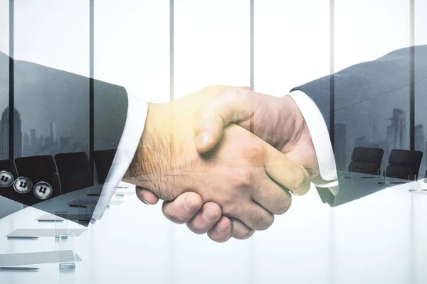 Handshake of two businessmen on conference room interior background, deal and partnership concept. Multiexposure — Stock Photo, Image