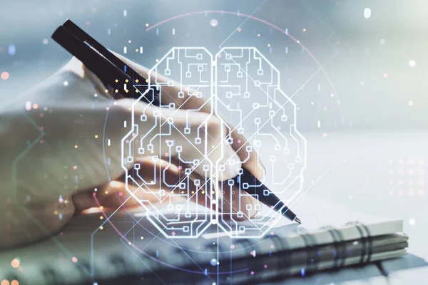 Creative artificial Intelligence concept with human brain hologram and woman hand writing in notebook on background. Multiexposure — Stock Photo, Image