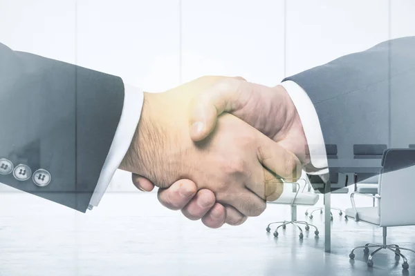 Double exposure of handshake two businessmen on meeting room interior background, research and strategy concept — Stock Photo, Image